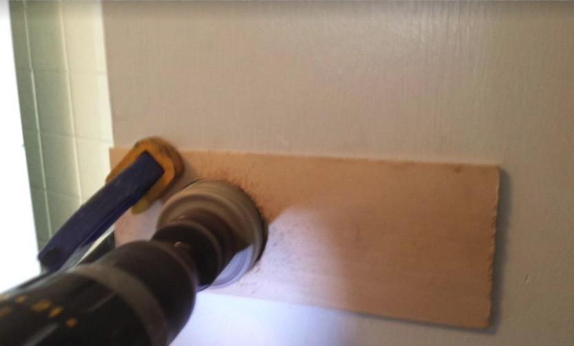 New door knob opening drilled through the old door
