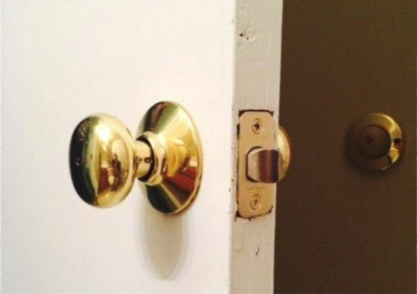 Modern door knob installed in the old door